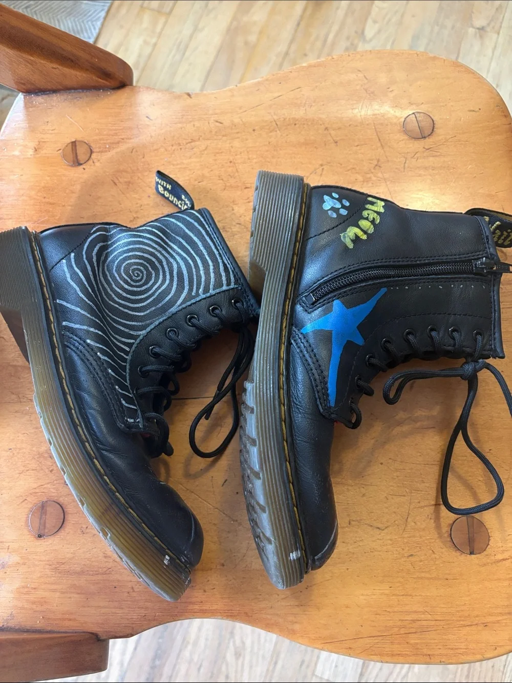Dr. Martens Black Leather Unisex Kids Lace-Up Boots with Original Paint Artwork